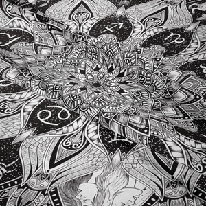 Detail shot of black and white bohemian tapestry with zodiac and mandala fabric texture