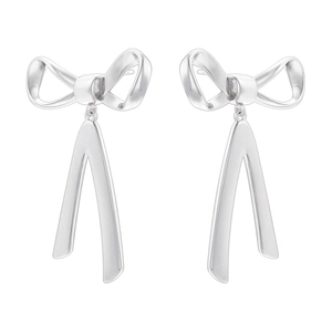 Detailed view of silver bow-shaped drop earrings featuring minimalist fluid metal tassels