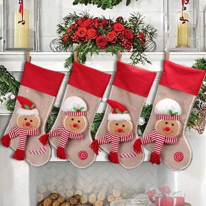 Set of 4 Christmas gingerbread man stockings hanging on a white fireplace mantel decoration