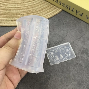 Transparent 3D silicone nail art mold set featuring bowknot and wing designs for DIY carving