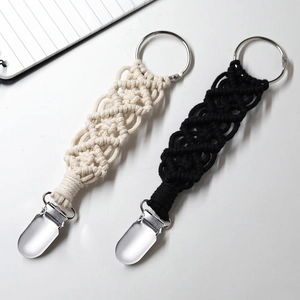 Set of woven cotton hat clips for travel bags in cream and black with metal rings