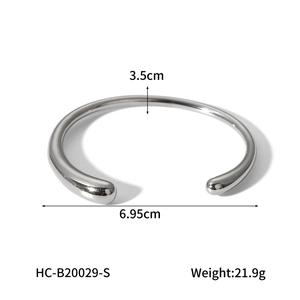 Polished silver titanium steel open bangle with rounded ends and dimensions shown