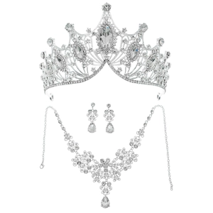 Sparkling bridal jewelry set featuring a silver rhinestone crown, necklace, and earrings