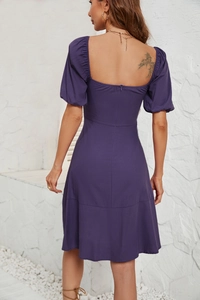 Detail of square neck puff sleeve dress featuring a back invisible zipper and purple fabric