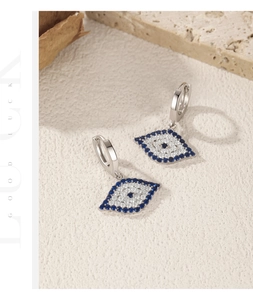 Detailed view of silver S925 evil eye drop earrings with blue and white zircon stones