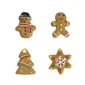 Miniature resin Christmas cookie charms featuring gingerbread man and snowman on white background