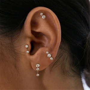 Close-up of s925 sterling silver bowknot earring set with sparkling diamonds on ear