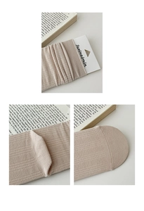 Detailed view of breathable cotton mid-calf socks with vertical ribbed texture and reinforced toe