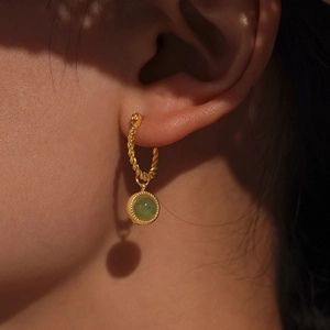 Luxury 18K gold-plated twisted hoop earrings featuring translucent green agate drop