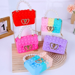 Kids silicone heart pop fidget handbag with pearl handle and golden chain strap