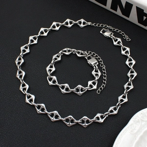 Detailed silver stainless steel chain necklace and bracelet set with geometric links