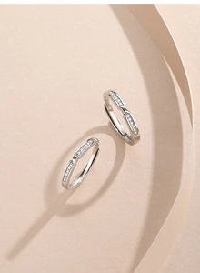 Macro shot of S925 sterling silver interlaced couple rings with zircon inlays