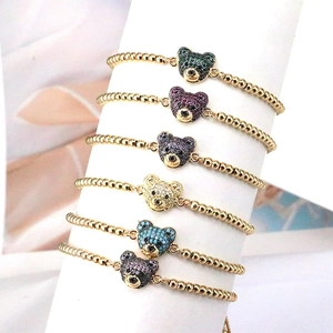 Set di braccialetti con perline dorate e orsetti in zircone colorato regolabili