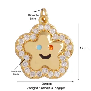 Detailed size view of a gold star pendant with smile face and white zircon edges