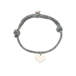 Detail of grey-blue woven cord bracelet with polished heart pendant and adjustable knot