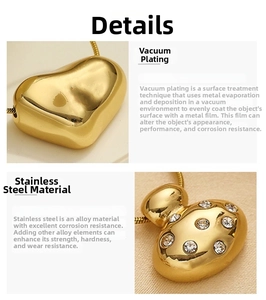 Detail of heart pendant with zirconia and vacuum-plated gold finish on stainless steel