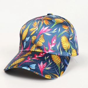 Detail of silk satin baseball cap featuring tropical floral and butterfly prints