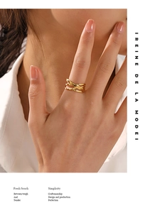 Detailed close-up of adjustable 18K gold-plated stainless steel criss-cross layered ring