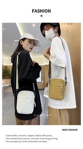 Vertical canvas crossbody bags in white and khaki with adjustable shoulder straps