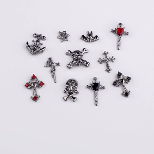 Gothic nail charms set in gunmetal finish featuring skulls, crosses, and bats