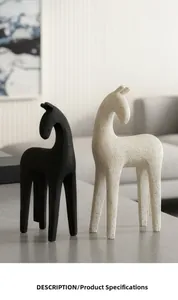 Close-up of minimalist resin horse statues with matte black and sandy textures