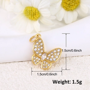 Macro view of gold-plated butterfly pendant with cubic zirconia and dimension labels