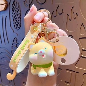 Süßer Shiba Inu Schlüsselanhänger mit PVC-Puppe, gelbem Armband und goldenem Metallring