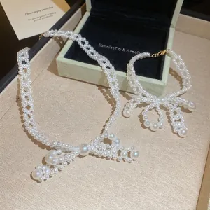 Parure élégante collier et bracelet en perles avec nœud en acier inoxydable