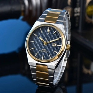 Detailed view of PRX watch with blue waffle dial and two-tone steel gold bracelet