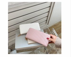 Vertical quilted long wallets in white and pink PU leather with gold zipper details