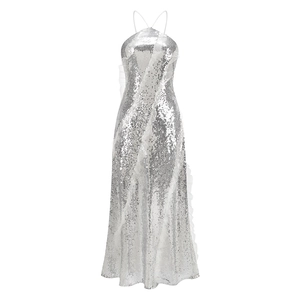 Close-up of silver sequins and asymmetrical ruffle detail on halter evening dress