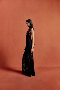 Close-up of black lace halter dress featuring an elegant 3D floral neck ornament