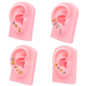 Clous d'oreilles luxe en or et argent avec zircons sur modèles d'oreilles roses