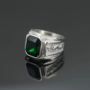 Silver dragon ring for men featuring a green square emerald-cut gemstone inlay