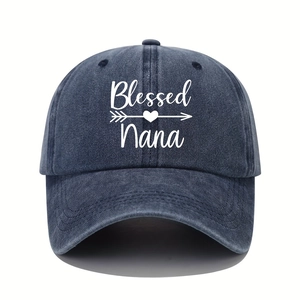 Close-up of Blessed Nana embroidery on a washed blue cotton baseball cap with heart detail