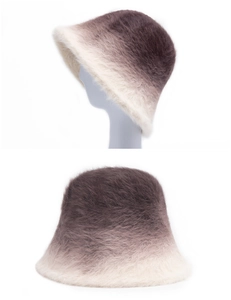 Close-up of plush gradient faux fur bucket hat with soft texture and warm fuzzy finish