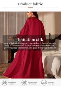 Detailed close-up of red satin nightgown with elegant grey lace cuffs and fabric care guide