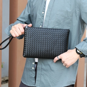 Men's black woven leather clutch bag with a wristlet strap and metallic zipper