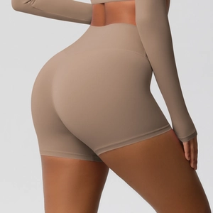 Detailed close-up of mocha high-waisted yoga shorts with seamless compression fabric
