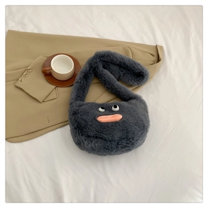 Detailed view of grey plush crossbody bag with quirky eyes and pink sausage lip design