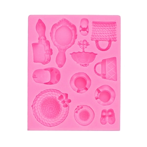 Pink silicone mold featuring miniature shapes of hats, bags, shoes and mirrors for resin crafts
