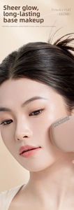 Close-up of Rubycell powder puff on model face showing flawless makeup application