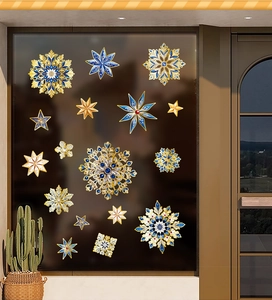 Detail of blue and gold Christmas snowflake static window stickers for festive decor