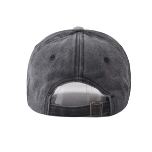 Close-up of the vintage washed cotton baseball cap featuring an adjustable metal buckle
