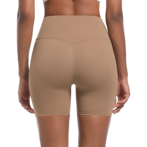 Detail view of high-waisted yoga shorts showing V-shaped back seam and lift effect
