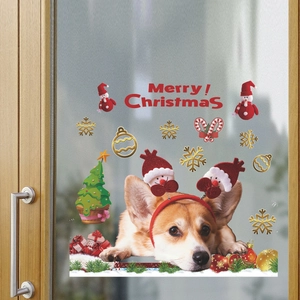 Christmas Corgi window stickers with reindeer antlers, snowmen, and festive decorations