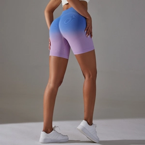Detail of high-waist seamless yoga shorts with blue-purple gradient and scrunch butt design