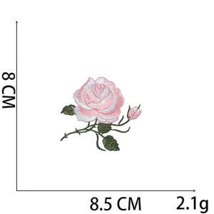 Macro detail of rose flower embroidery patch with 8.5 cm width and 8 cm height
