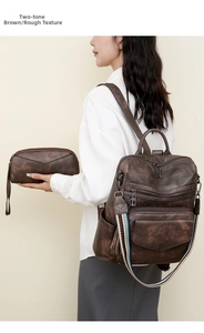 Detail of dark brown retro leather backpack set with colorful striped woven shoulder strap