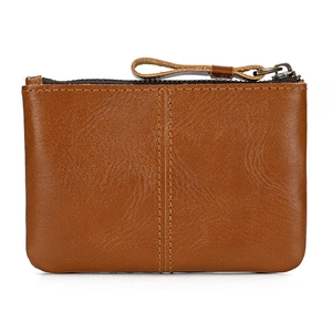 Compact crazy horse leather coin purse in dark brown with top zipper and vintage stitching